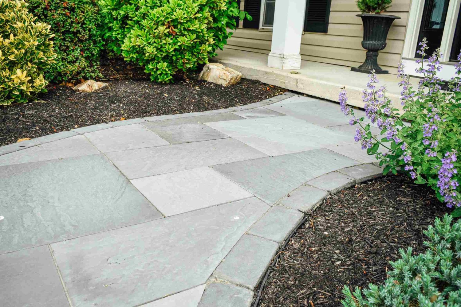Bluestone walkway and entry — natural stone patio material for Wilmington homes