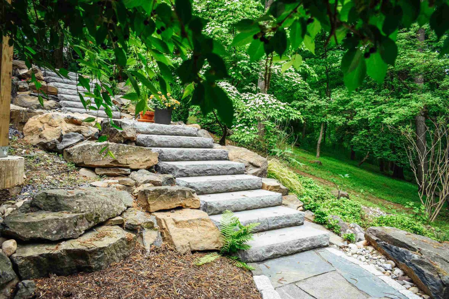 Boulder steps with integrated landscaping and drainage