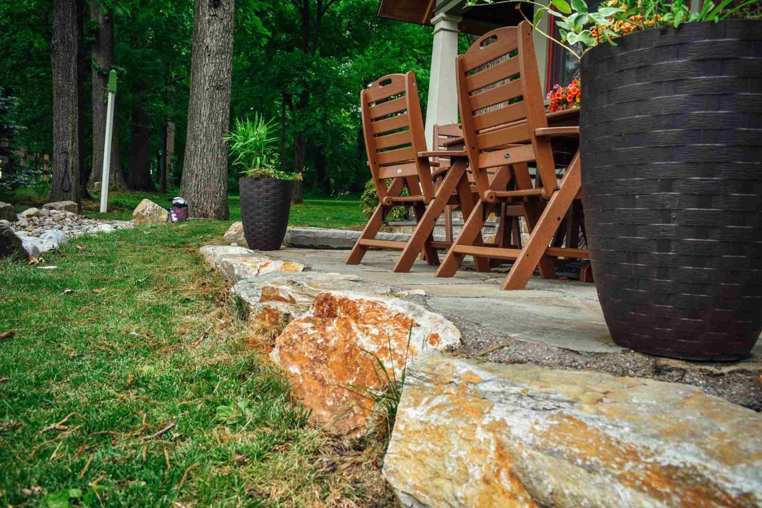 Stone wall and patio detail — expert hardscaping by Pickel Landscape Group