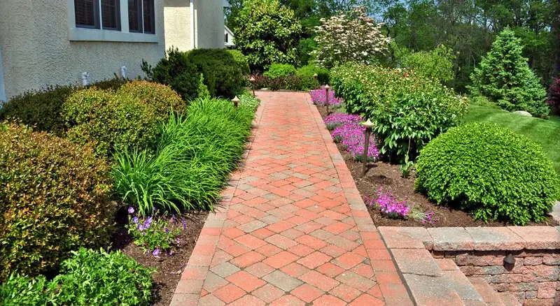 Brick herringbone walkway with garden beds