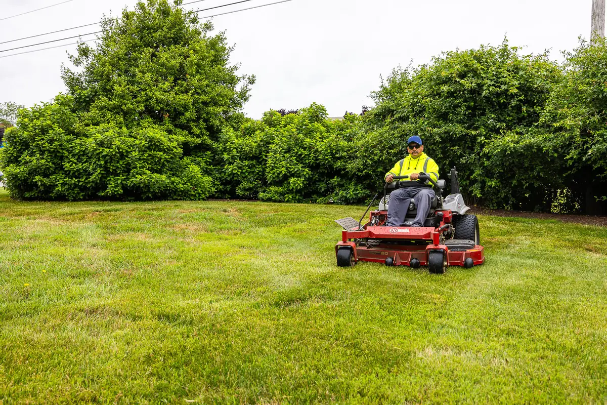 Zero-turn mower maintaining a clean cut on a commercial HOA lawn in southeastern Pennsylvania