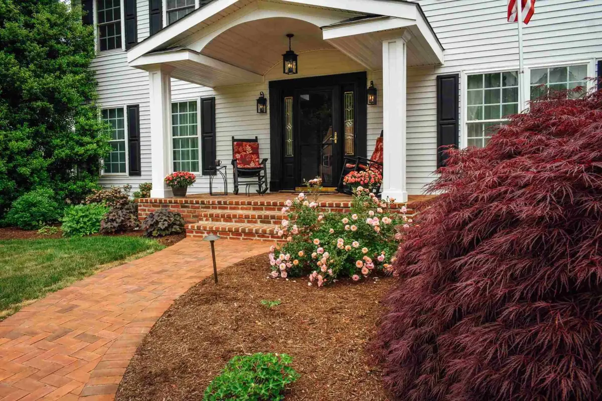 Brick walkway with front porch
